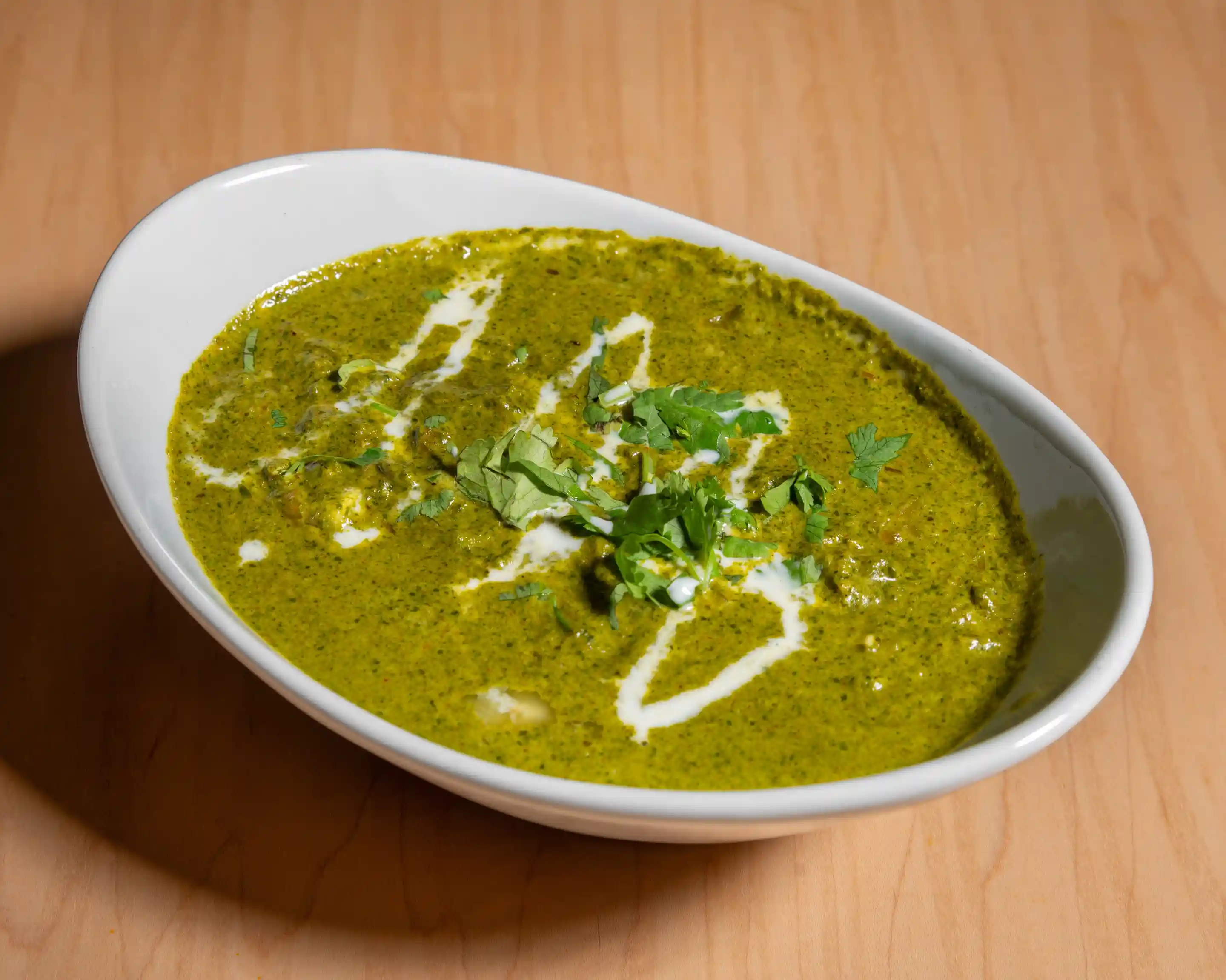 Palak paneer - fresh cottage cheese cubes in spiced spinach gravy