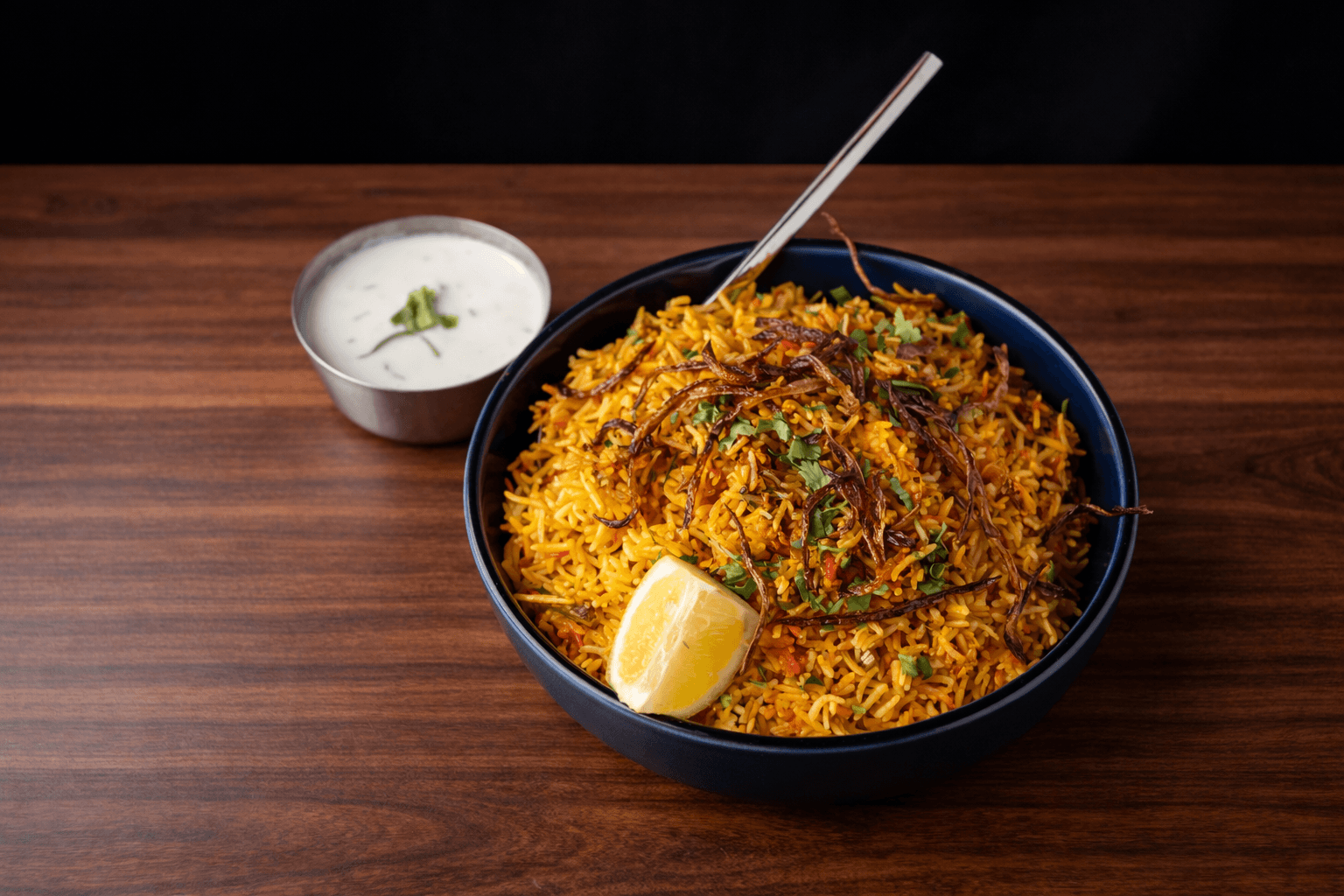 Aromatic dum biryani with caramelised onions and fresh coriander