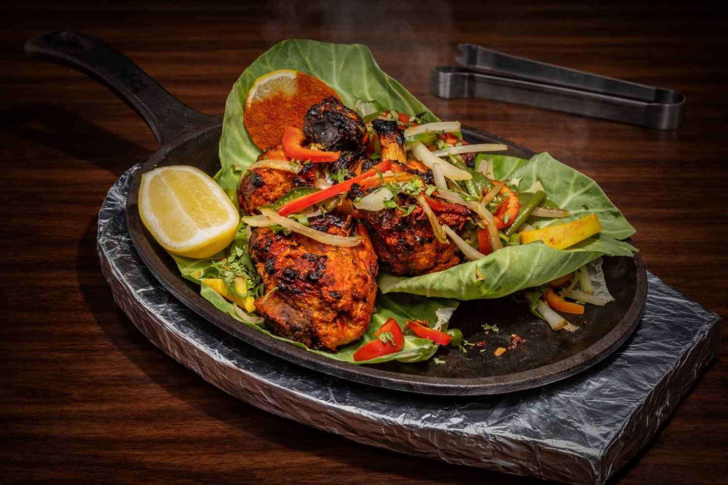 Garlic naan - fresh flatbread baked on tandoor walls with garlic butter